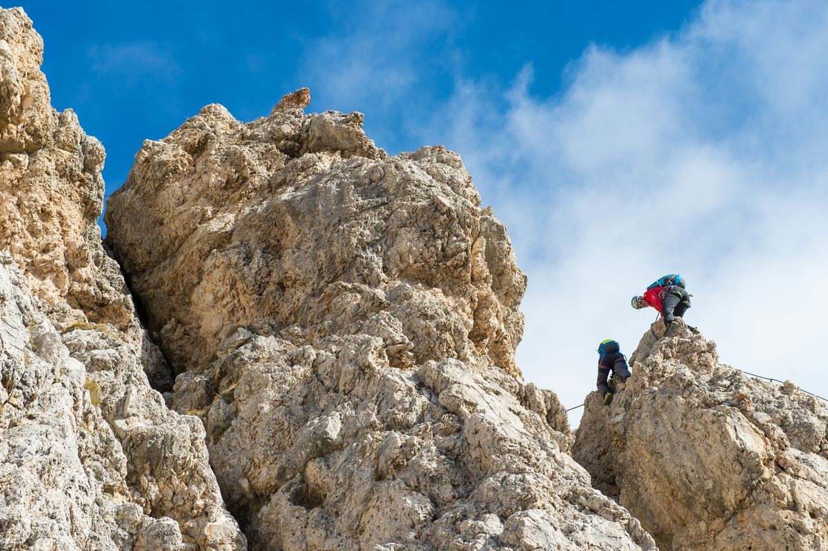 two climbers on the rocks in risk situation